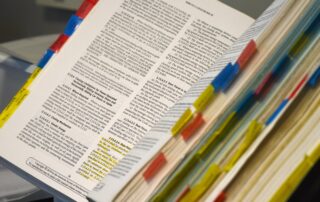 book of standard operating procedures with highlights and tabs